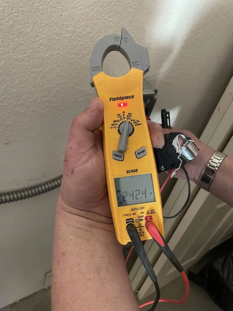 Voltage testing with clamp meter during Aluminum Wiring Replacement in Marion